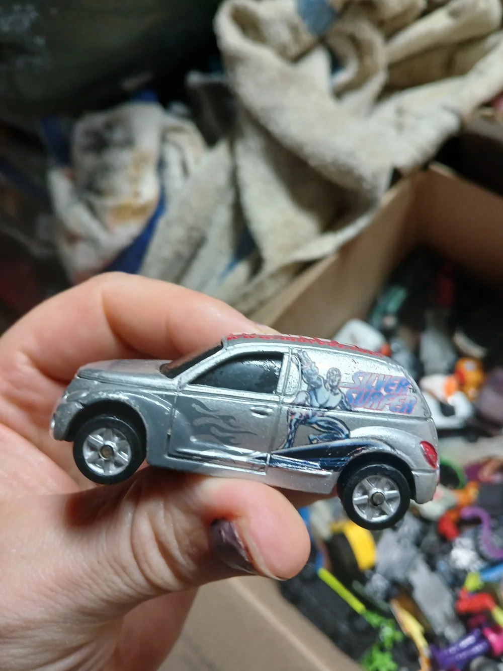 1:64 scale 2002 Maisto Chrysler Panel Cruiser featuring the Silver Surfer